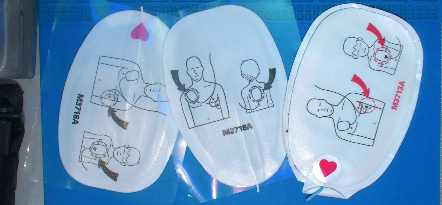 Defibrillator pads for off-label use as non-vented chest seals.